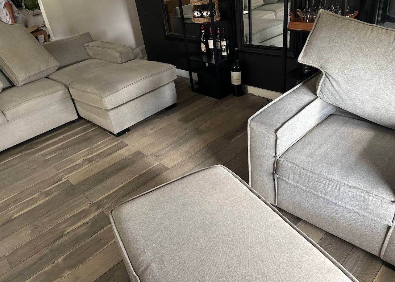 A freshly cleaned grey sectional in a Denver home